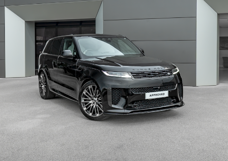 Black SUV parked on a grey surface, front and side view.