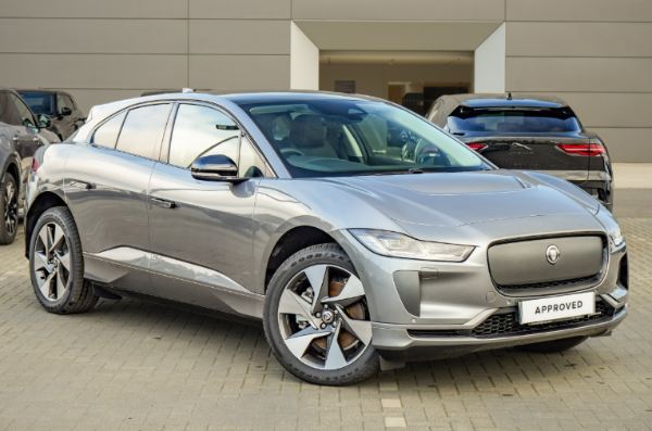 Silver Jaguar I-PACE electric car parked on a paved surface.