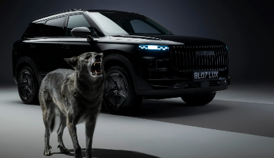 Black SUV with illuminated lights beside a wolf baring its teeth.