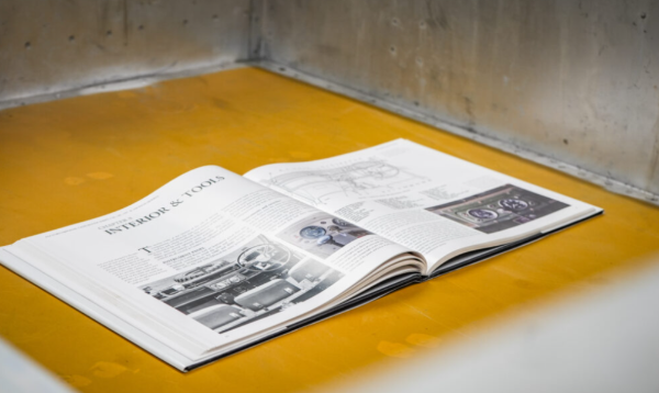 Open book titled Interior & Tools with car diagrams and images.